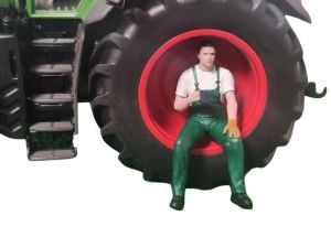 ATLAN32025_VERT - Figurine en cotte verte - Homme assis en pause