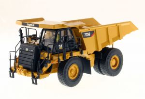 DCM85909 - CATERPILLAR 775G accompagné d'une figurine et d'une boite en métal