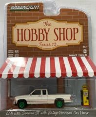 GREEN97120-DVERT - Voiture sous blister jantes verte - GMC Sonoma ST avec pompe à essence Pennzoil Vintage 1991 THE HOBBY SHOP séries 12
