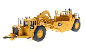 DCM85175 - CATERPILLAR 657G bi-moteur équipé de la boucle de tractage accompagné d'une figurine